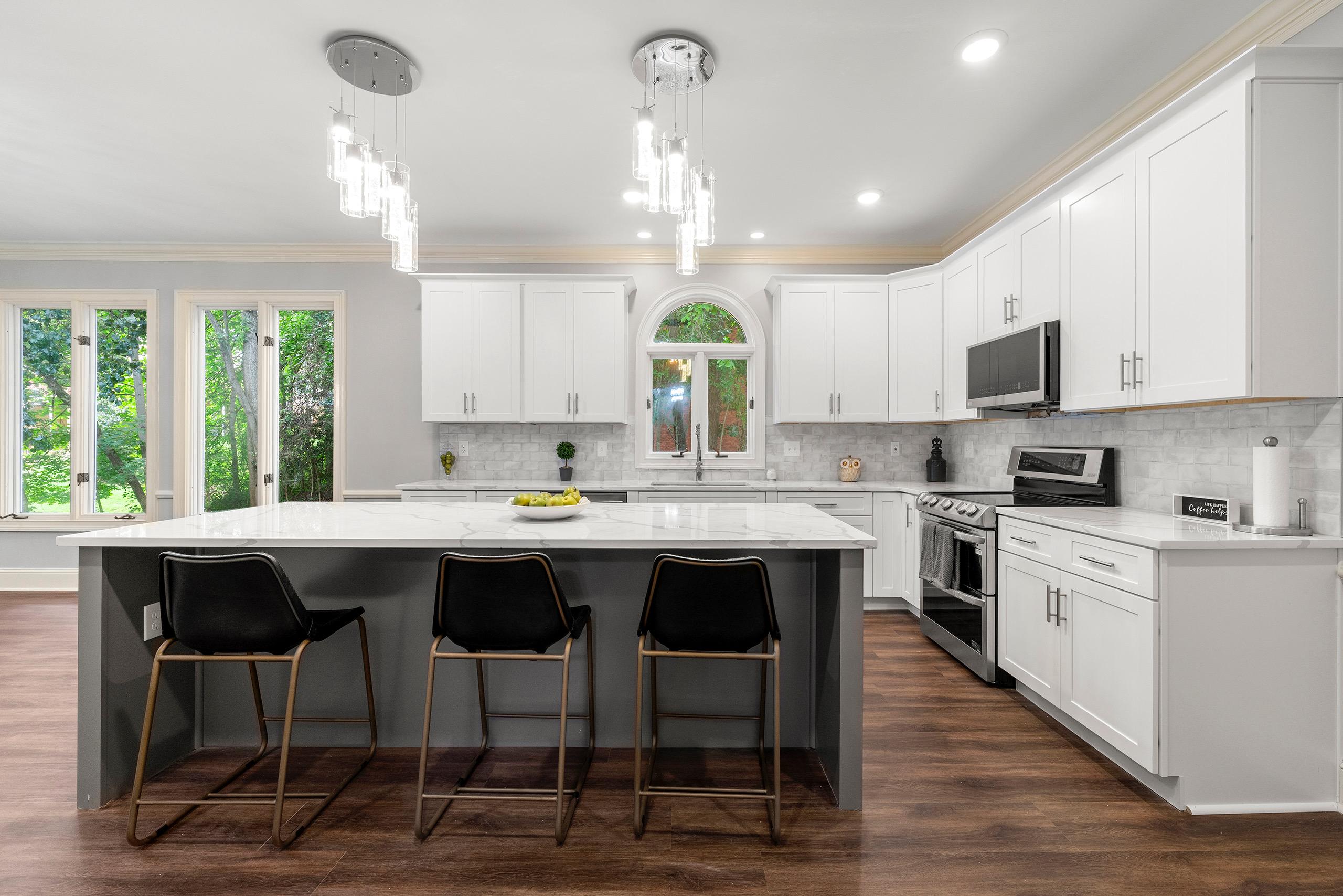 White shaker cabinets with quartz island